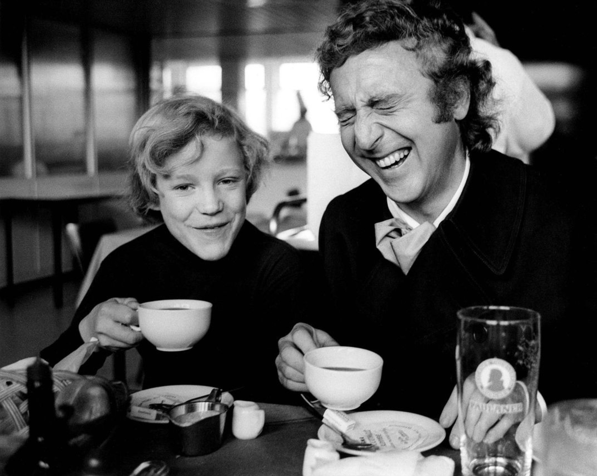 Gene Wilder and Peter Ostrum laughing on a break